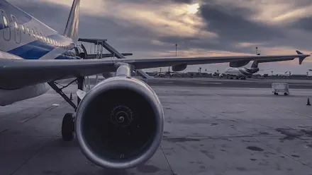 A close of of an aircarft wing and the engine